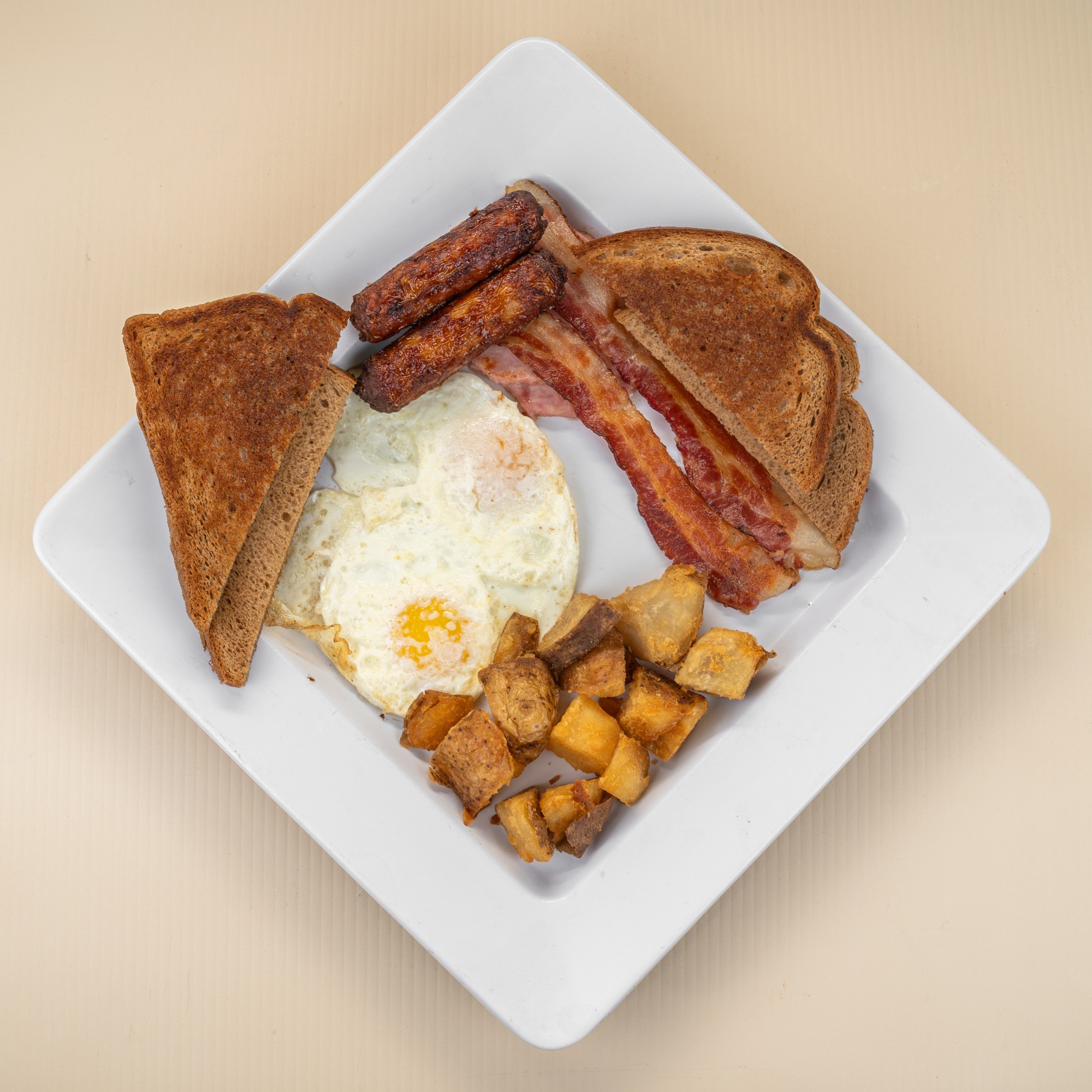 2 Eggs w/ Bacon, Ham, Sausage.